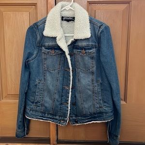 Denim jacket with white faux fur neck